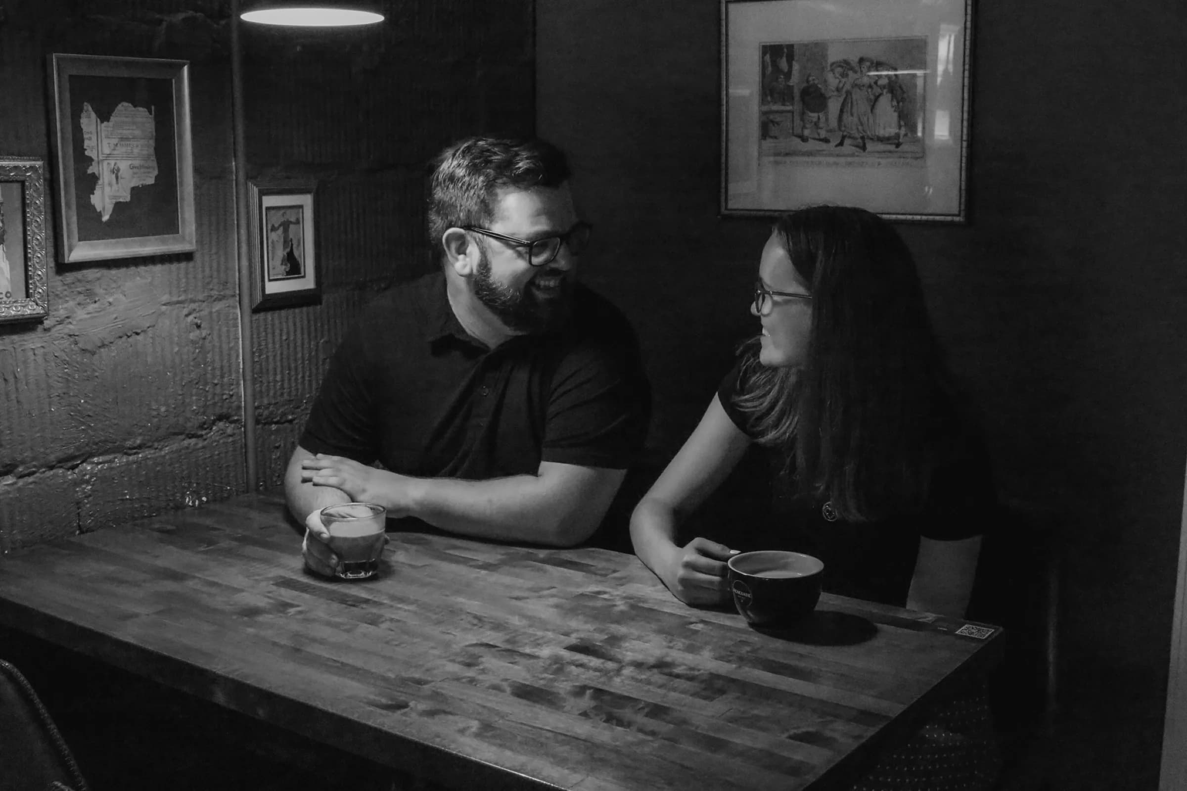 Black-and-white seated couple