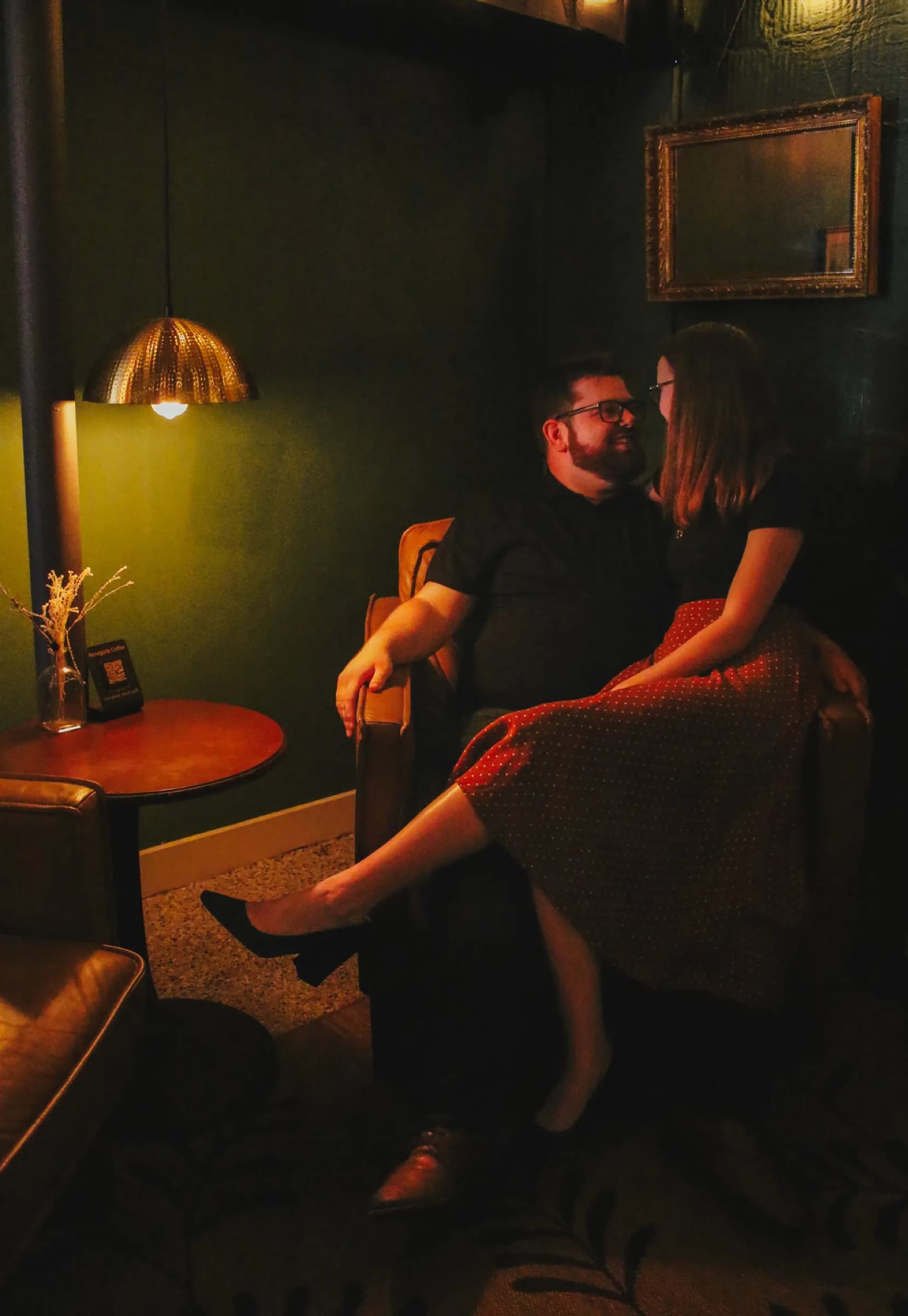 Couple seated closely in a lounge