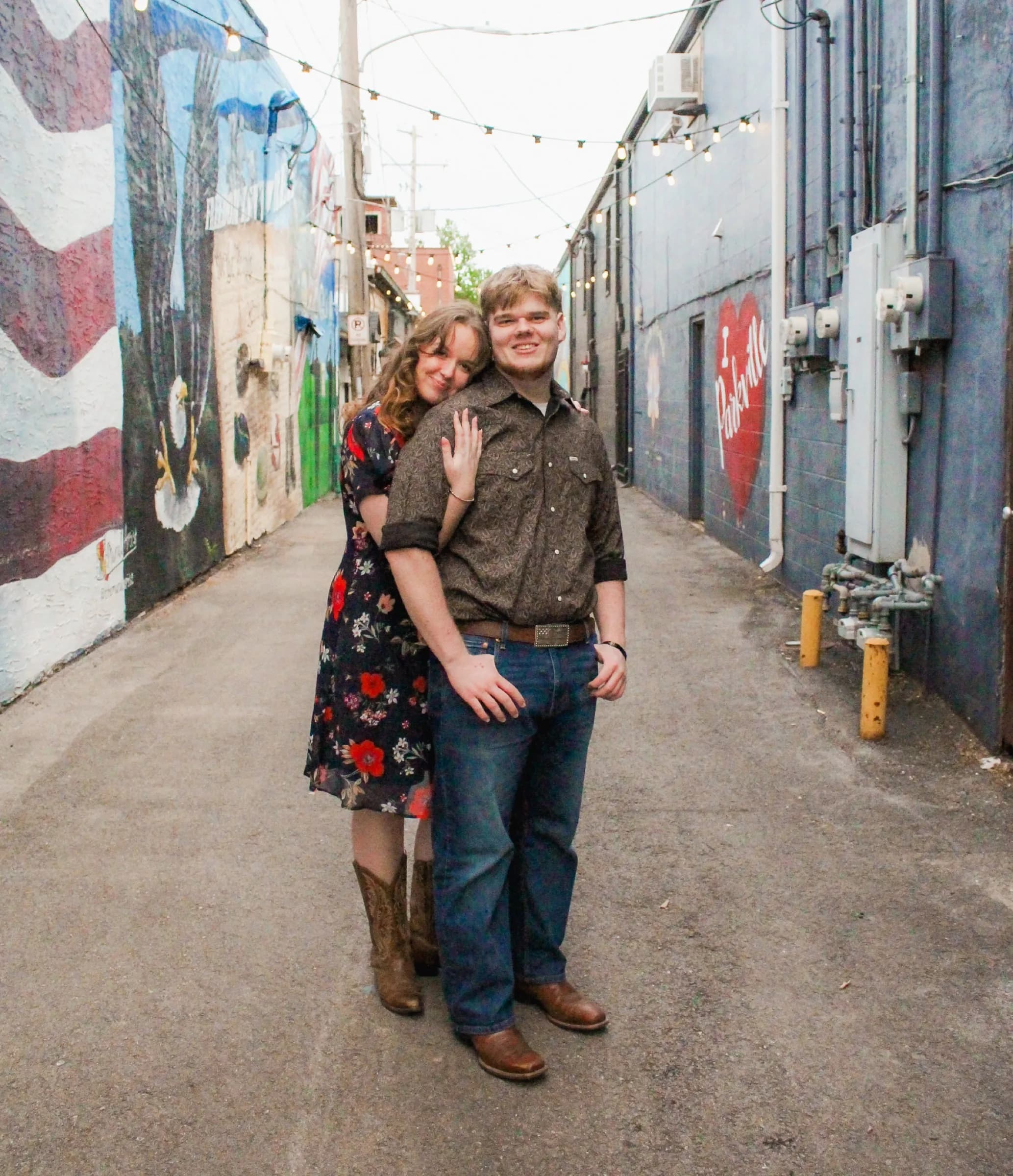 Couple in mural alley