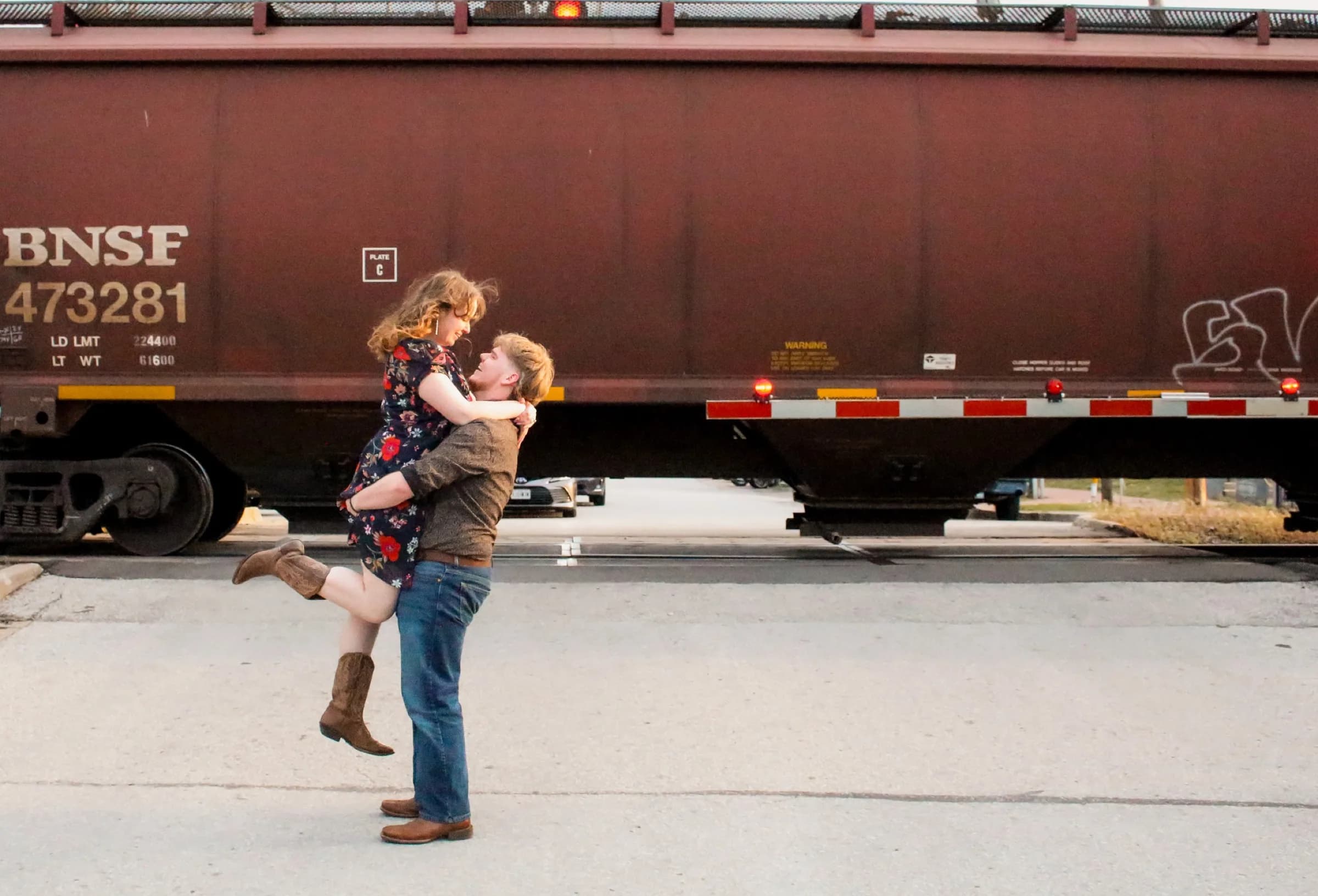 Dynamic couple portrait near train