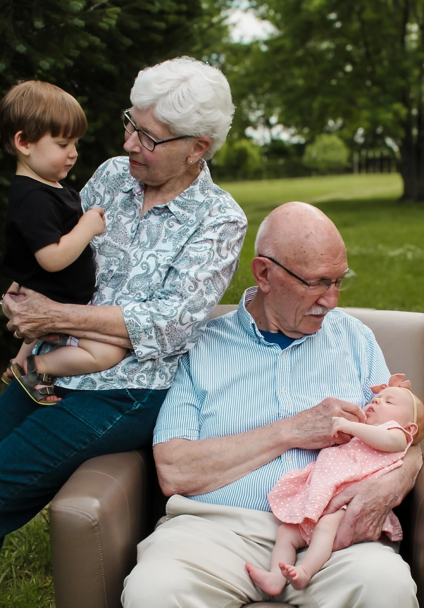 A multigenerational family sharing a quiet moment outdoors