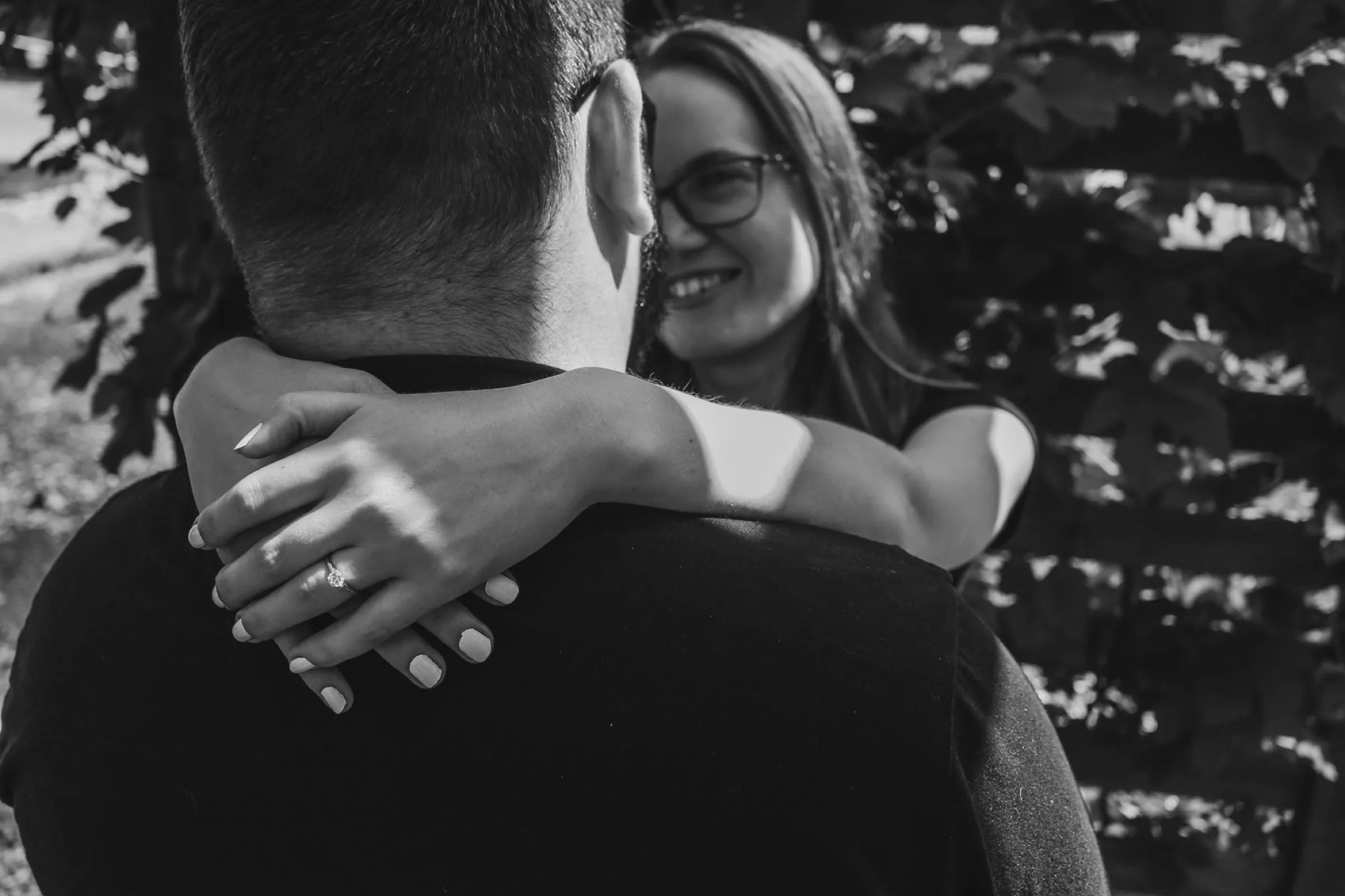 Black-and-white close couple embrace