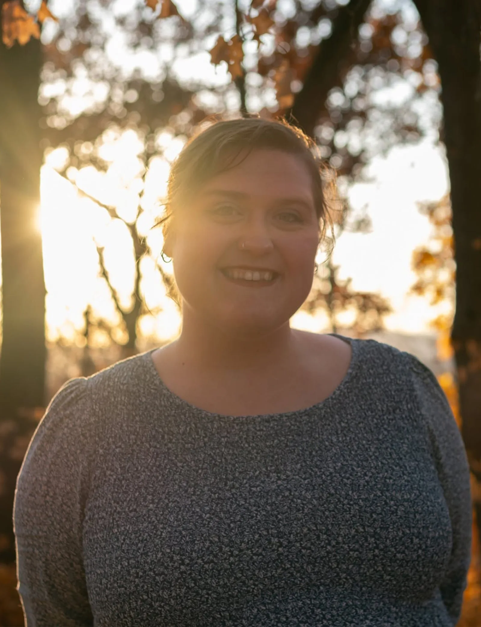 Kaitlynn King smiling outdoors at sunset